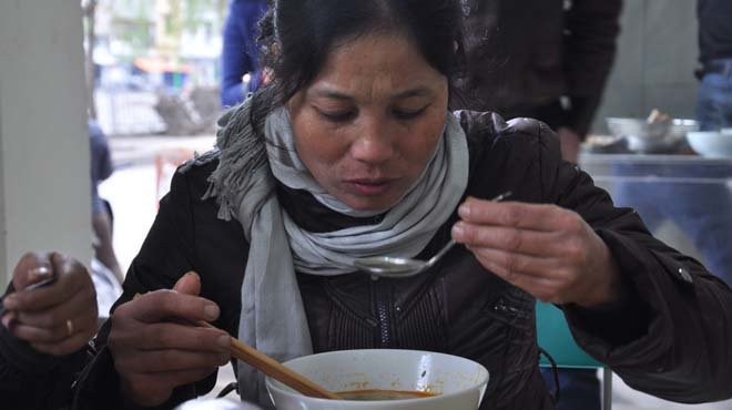 Eat warm bowl of pho in Hanoi winter